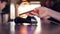 Girl in cafe paying with his phone. Wireless payment concept. 4K.