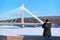 Girl with camera at Candle bridge in winter Rovaniemi