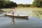 Girl on canoe at isla de las flores on river Dulce