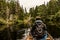 Girl canoeing with Canoe on the lake of two rivers in the algonquin national park in Ontario Canada on cloudy day