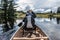 Girl canoeing with Canoe on the lake of two rivers in the algonquin national park in Ontario Canada on sunny cloudy day