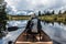 Girl canoeing with Canoe on the lake of two rivers in the algonquin national park in Ontario Canada on sunny cloudy day