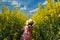 Girl in a canola field