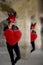 Girl in carnival dancing with big red heart