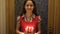 Girl carries the birthday cake with candles