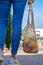 Girl carries fruits and vegetables in an eco-friendly string