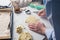 Girl carves cookies in the shape of a heart in the kitchen, at home, close-up. Handmade pastries with love for Valentine`s day,