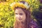 Girl with chaplet on head in the garden