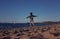 Girl chasing seagulls on beach