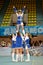 Girl from cheerleaders team Jam performs stunt