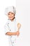 Girl chef with large spoon peeking from board