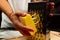 Girl chef rubs fresh fragrant cheese on a grater for making homemade italian pizza on a cutting board