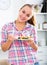 Girl with chestnut hair eating salad