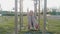 Girl child engaged in workout on street exercise equipment in the summer in the park.