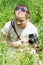 Girl child photographing old camera.