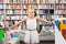 Girl child puzzled of selection of books in the store