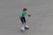 Girl child roller skates on sport playground
