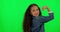 Girl child, strong muscle and green screen with face, flex and mockup for children, fashion and happy for playing. Young