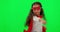 Girl child, superhero and green screen with punch, fight and justice with smile on face for mockup. Young female kid