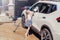 girl child washing cleaning car