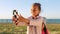 Girl children, park and selfie with smartphone, adventure on day trip outdoor, nature and technology with photography