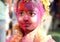Girl Children smeared with holi colours all over the face