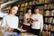 Girl choosing book with parents