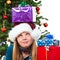 Girl with christmas gift on head rolling her eyes