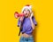 Girl in Christmas hat with pink megaphone