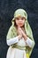 Girl in a Christmas outfit. Attire for the reconstruction of the history of the birth of Jesus Christ. Girl in biblical costume,