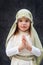 Girl in a Christmas outfit. Attire for the reconstruction of the history of the birth of Jesus Christ. Girl in biblical costume,