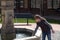 Girl in city fountain