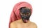 Girl with a clay cosmetic mask on her face makes faces. Spa procedures.  on white background