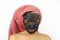 Girl with a clay cosmetic mask on her face makes faces. Spa procedures.  on white background