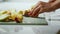 Girl cleans and cuts the banana for making cake