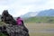 Girl on a cliff overlooking the mountains