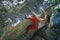 Girl climbing boulder.