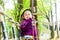 Girl climbing in high rope course