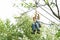 Girl is climbing on obstacle course