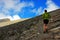 Girl climbing up to Skala peak on Mount Olympus