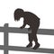 Girl climbing a wooden fence
