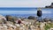 Girl climbs over the rocks at Giants Causeway in Northern Ireland