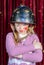 Girl in Clown Make Up and Helmet with Arms Crossed