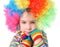 Girl in clown wig and multicolored gloves