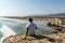 Girl coastside view Taqah plateau City Salalah Dhofar Sultanate Oman