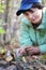 Girl collect mushroom on forest