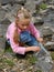 Girl collecting mussels