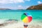 Girl with color full umbrella on the sandy beach