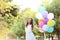 Girl with colored balloons