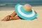 Girl with colorfull hat on the beach